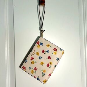 Kate Spade wristlet, cream floral print, barely used. Great condition!